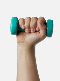 Close-up of hands over white background
