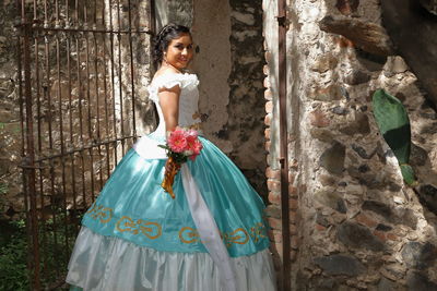 Portrait of a young woman standing outdoors