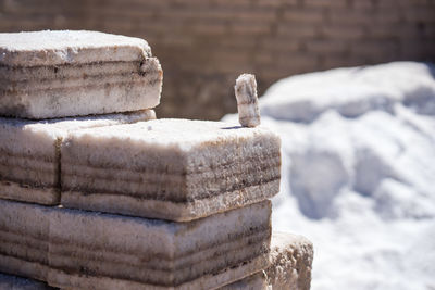 Close-up of stone stack on snow