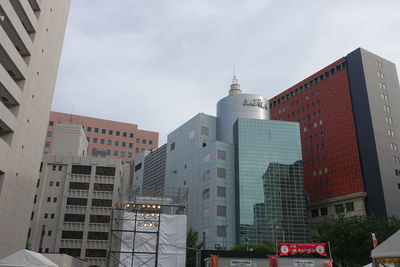 Low angle view of buildings in city against sky