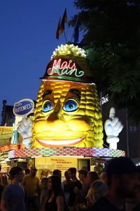 People in illuminated traditional building