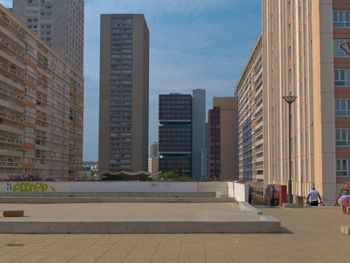 Modern buildings in city against sky