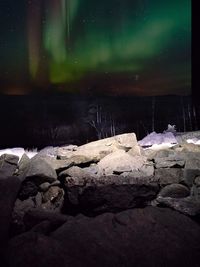 Snow covered landscape at night