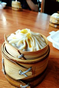 Close-up of dumpling in basket on table