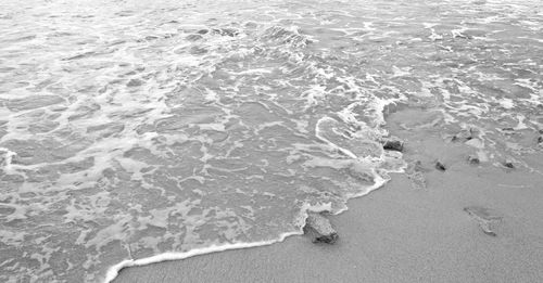 High angle view of surf on beach