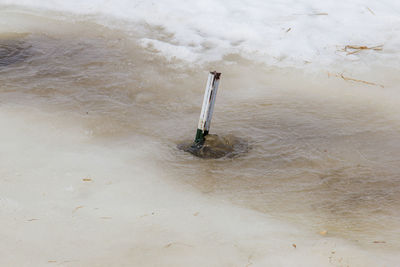 High angle view of pole on beach during winter