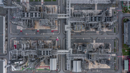 Aerial top view oil and gas refinery petrochemical plant industrial with oil and gas storage tank.