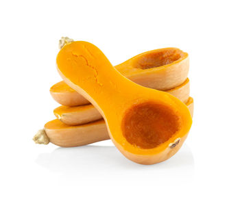 Close-up of orange slice against white background