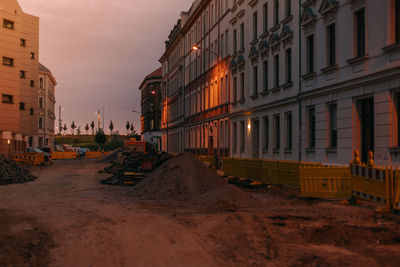Road construction in residential neighborhood during sunset 