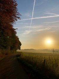 Scenic view of field against sky during sunset