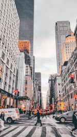 City street amidst buildings against sky