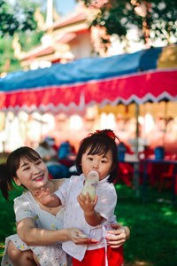 Portrait of smiling mother and daughter