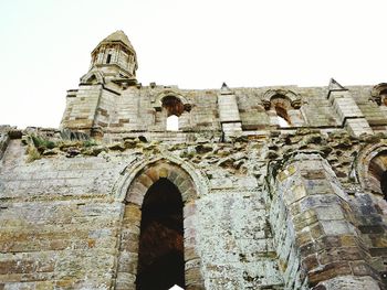 Exterior of historic church against clear sky