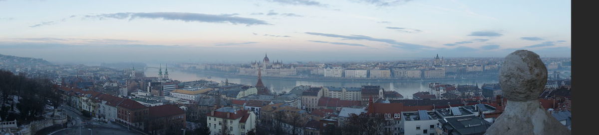 High angle view of city buildings during sunset