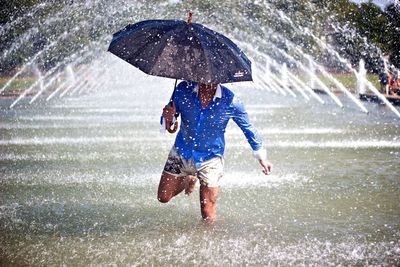 Woman jumping in water