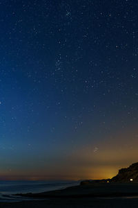 Scenic view of sea against sky at night