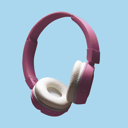 Close-up of headphones against blue background