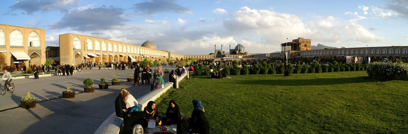 Panoramic view of people in town square