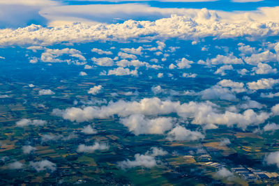 Aerial view of cloudscape over field