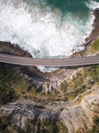 High angle view of rocks in sea