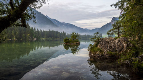 Scenic view of lake and mountains against sky