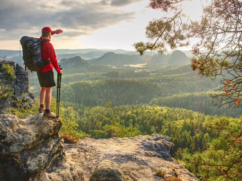 Man looking at view of mountains