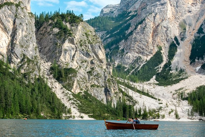 Scenic view of river amidst mountains