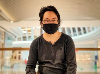 Portrait of young man wearing mask