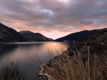 Scenic view of lake against sky during sunset