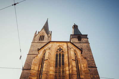 Low angle view of bell tower against clear sky