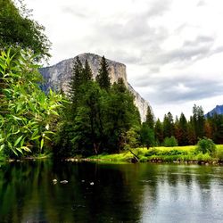 Scenic view of lake against cloudy sky