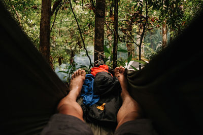 Low section of man lying down on land