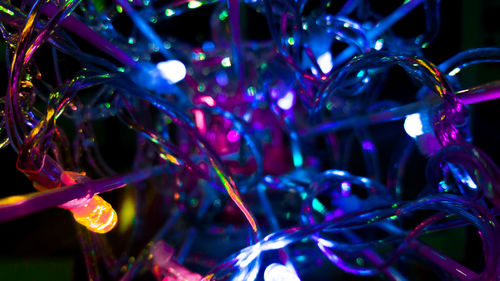 Close-up of illuminated christmas lights at night