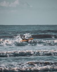 Surfer on sea