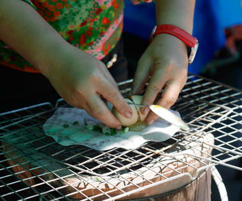 Midsection of woman preparing food