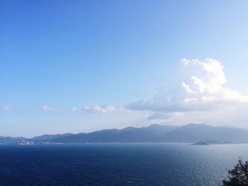 Scenic view of sea against blue sky