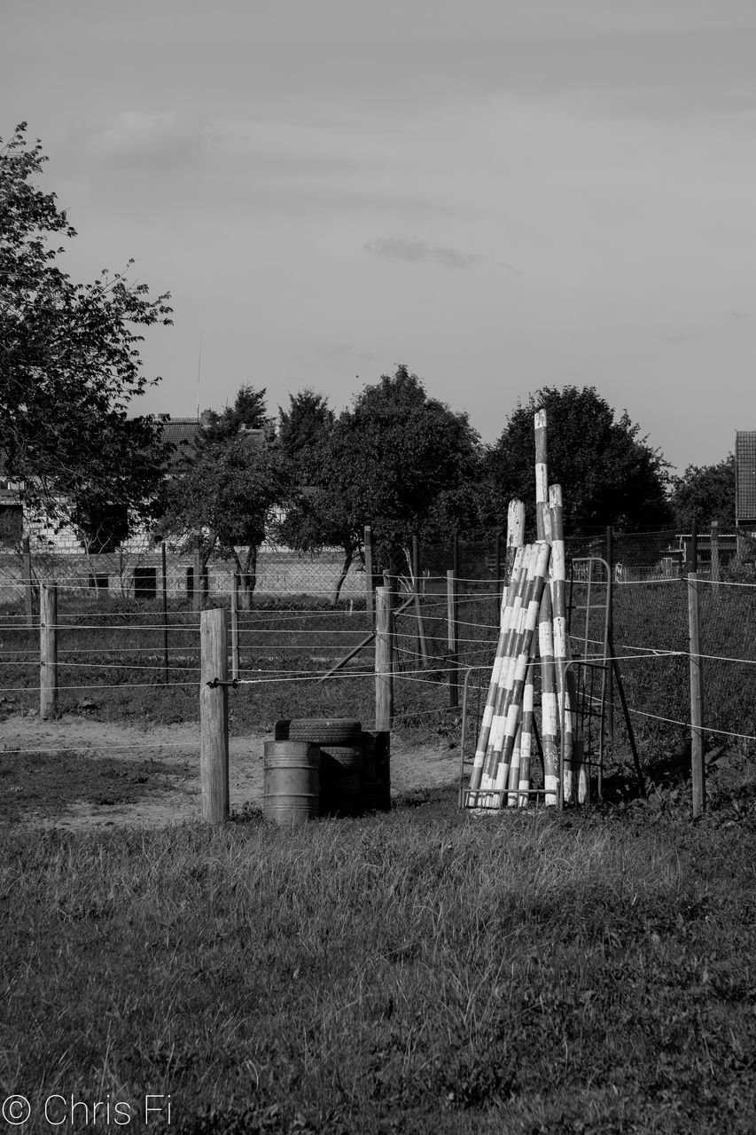 FENCE ON FIELD AGAINST SKY