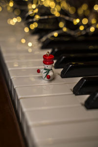 Christmas music. piano keyboard with garland lights. new year spirit