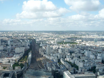 High angle view of city buildings against sky