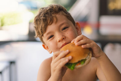 Close-up of boy eating food