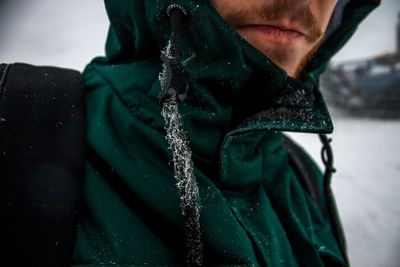 Close-up of man wearing mask standing outdoors