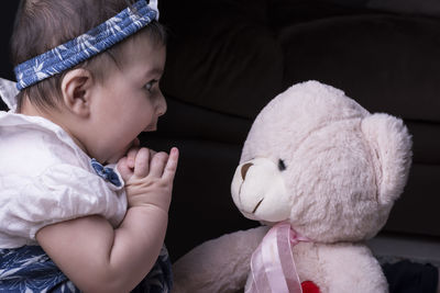 Close-up of cute girl with toy toys