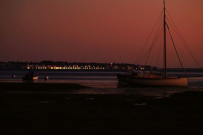 View of boats in sea at night