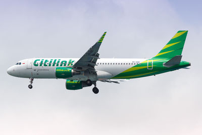 Low angle view of airplane against clear sky