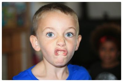 Close-up portrait of boy making a face