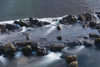 Scenic view of water flowing through rocks