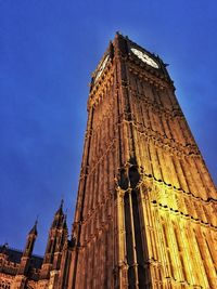 Low angle view of clock tower against sky