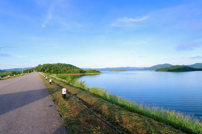 Scenic view of lake against blue sky