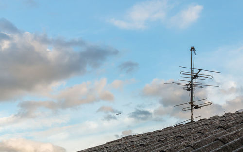 Low angle view of roof and building against sky