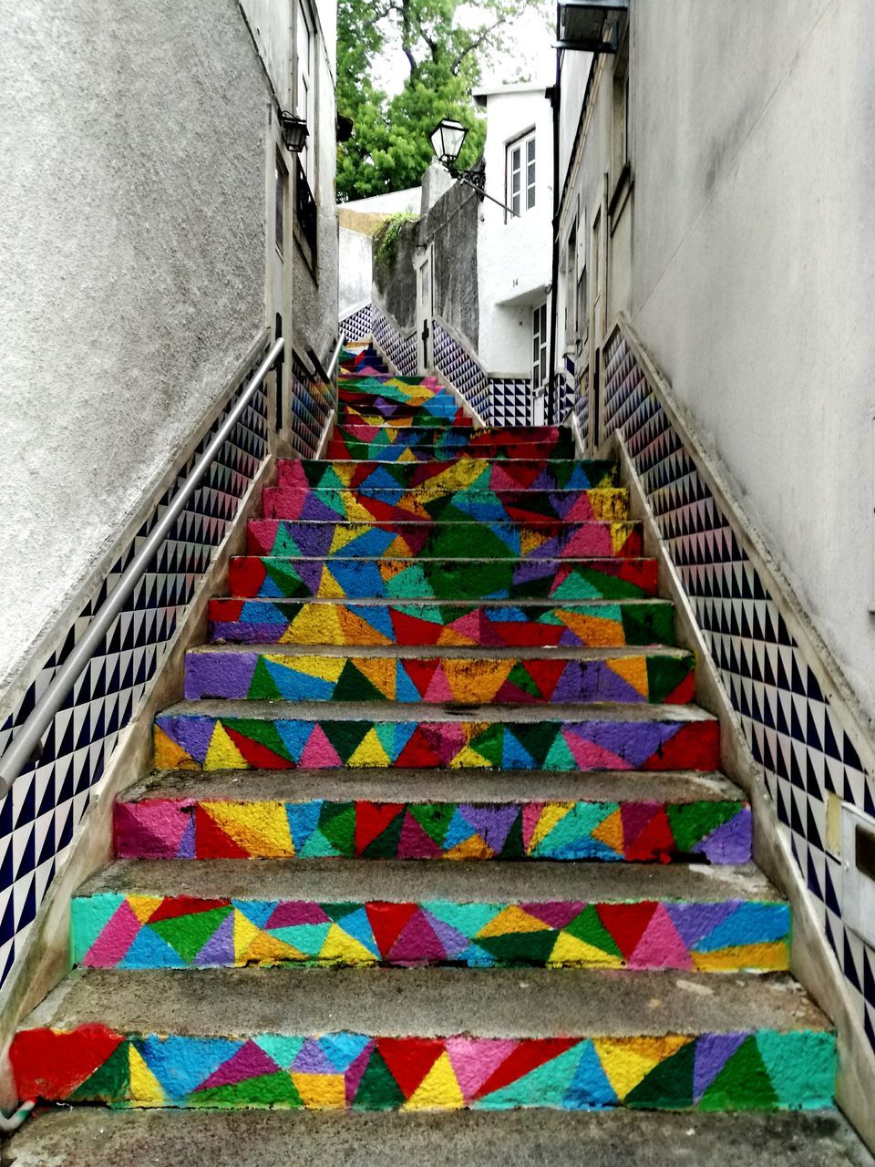 MULTI COLORED STEPS LEADING TOWARDS STAIRS